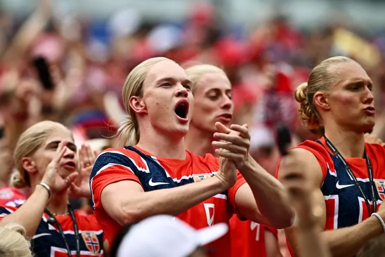 Norway fans react inside the stadium before the match.