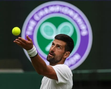 Novak Djokovic serves