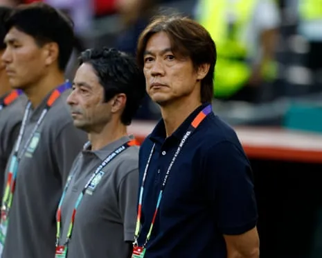 Hong Myung-bo coach lines up pitchside at Monterrey Stadium