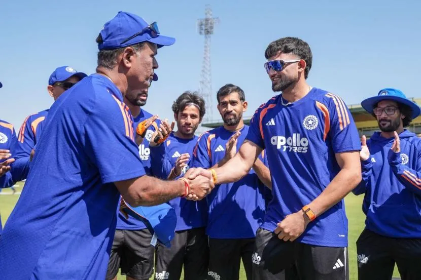 Ashok Sharma recieves his T20I cap from Sunil Joshi